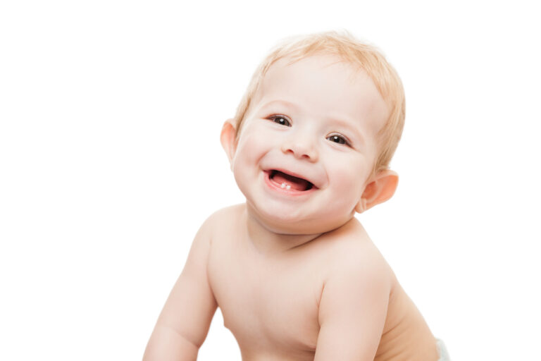 Little cute newborn baby child first milk teeth smiling